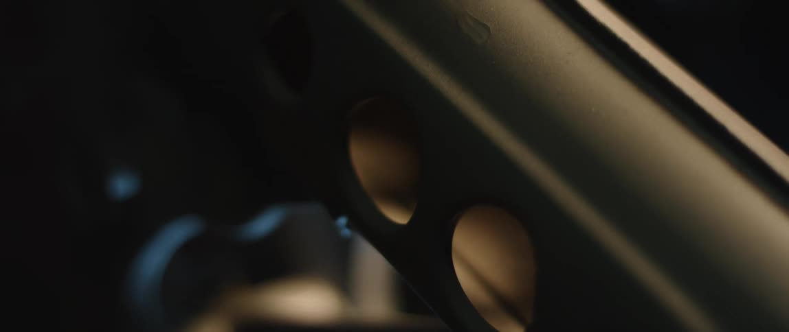 An object moves in a golden or golden hued environment or lighting creating a striking or memorable visual effect