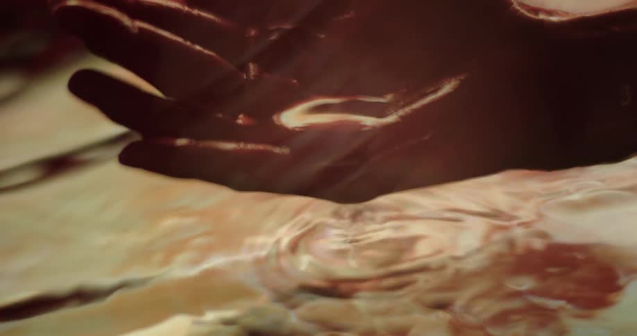 Close up of hand holding water in cupped hand