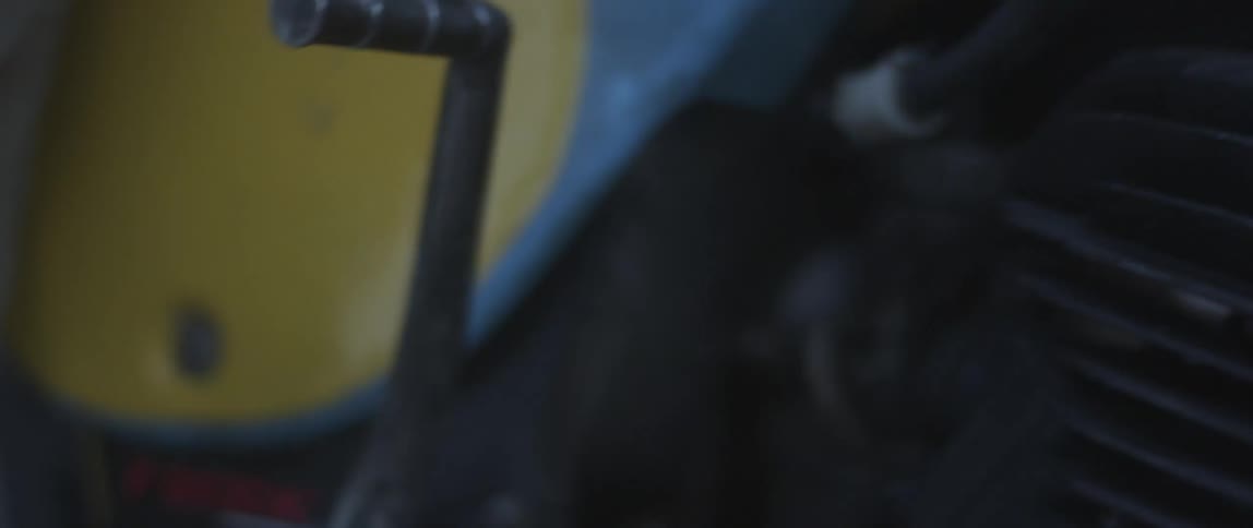 A person starts their motorcycle