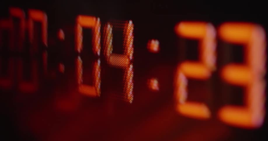 Hectic digital clock counting down seconds and milliseconds causing stress on a retro computer screen with glitches and distortion