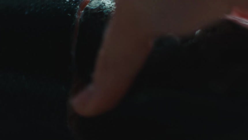 Close up of the hands of a chef using a sharp kitchen knife to remove the skin of a fish