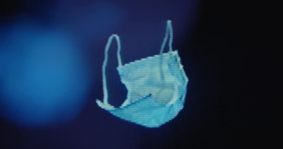 Macro shot of a digitized 3D medical face mask offering protection while spinning on a pixelated RGB tube TV screen