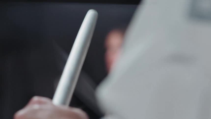 Close up of the hands of a chef sharpening a kitchen knife in a restaurant