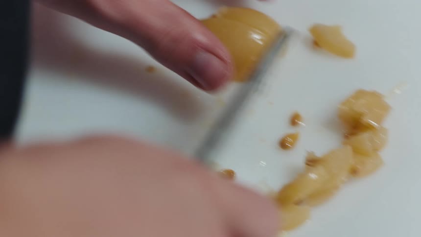A person is cutting some food