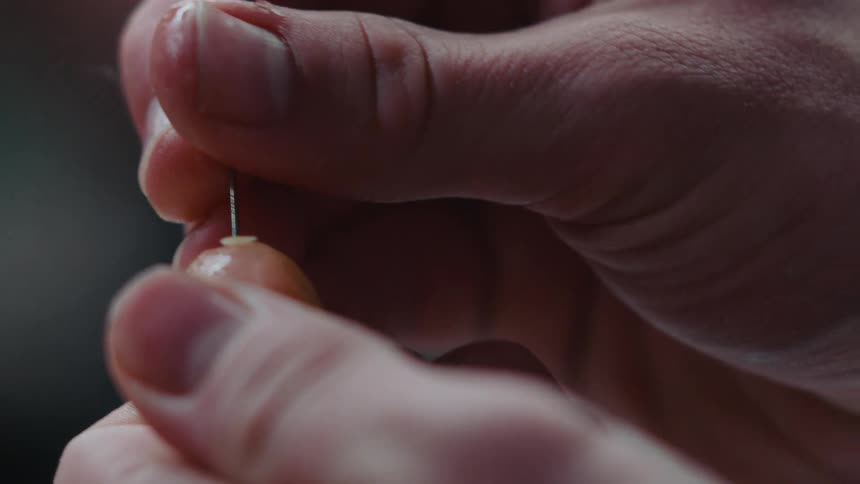 A cook puts a pin in food