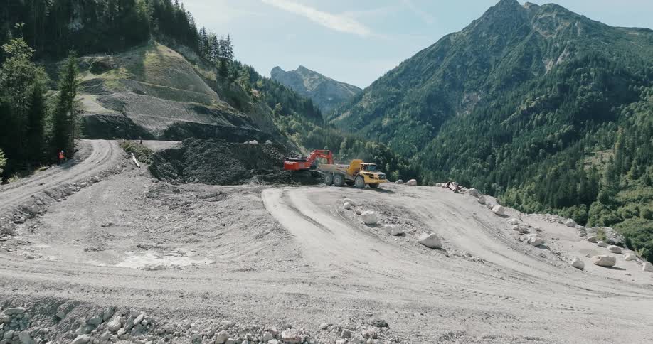 A dump truck is parked in the quarry