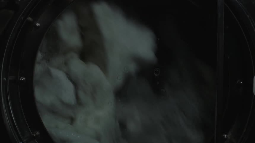 Laundry tumbles in a washer