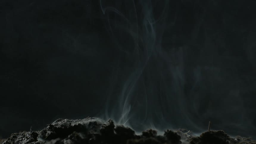 Smoke rises from the ground