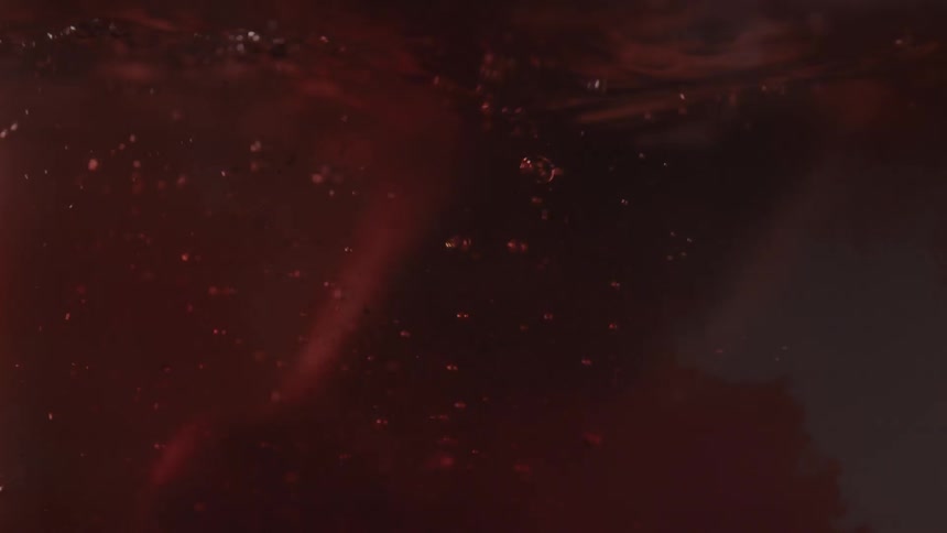 A bloody hand falls into water