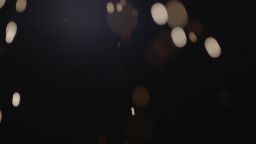 Sparks fall in a dark area