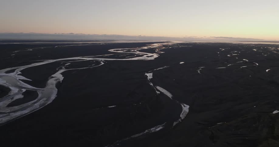 Aerial view of a landscape is displayed at dusk