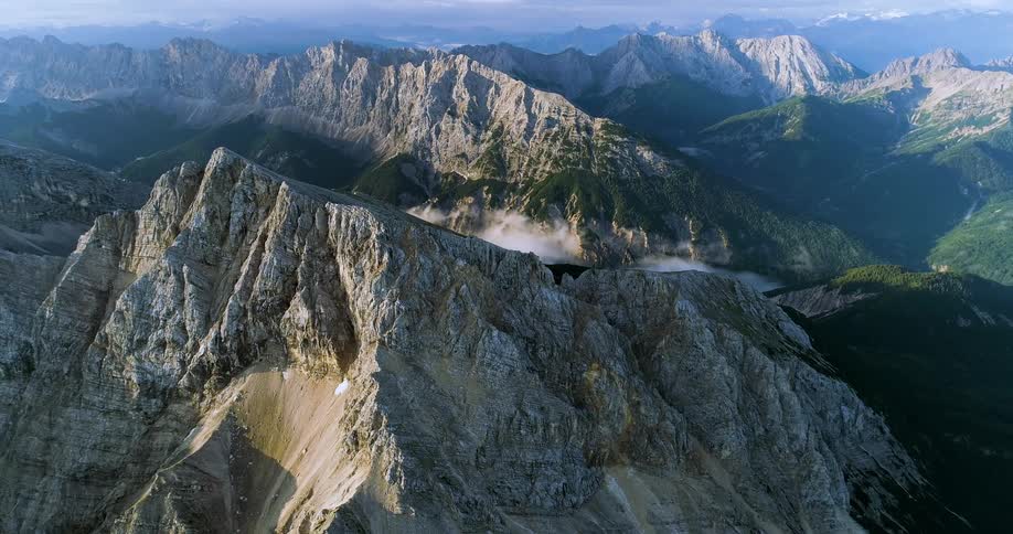 An aerial view of mountains are displayed