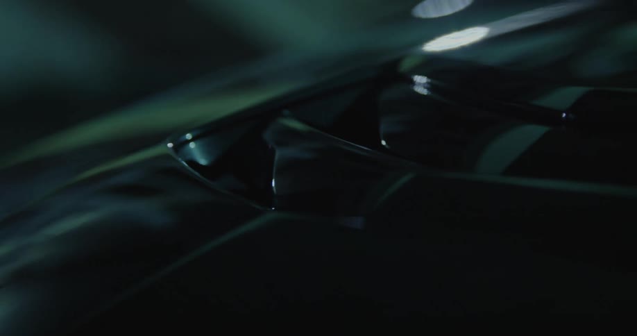 A close up of a black car hood