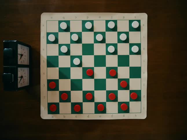 A game of checkers set up on a table