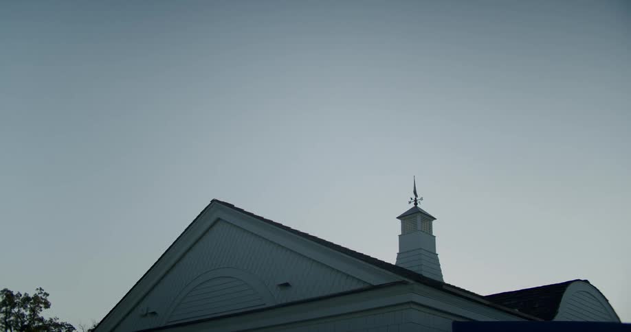 A white building with a clear sky
