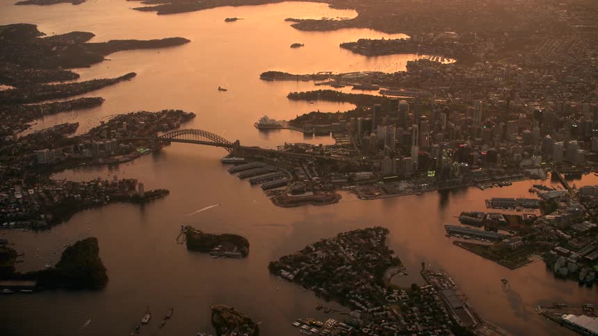 Aerial view of a downtown city near the ocean is displayed
