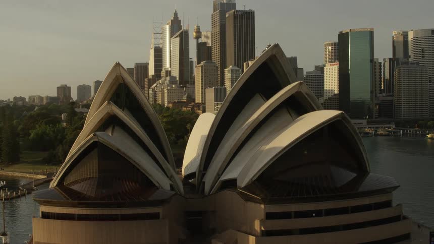 Orbital aerial view of the sydney opera at evening