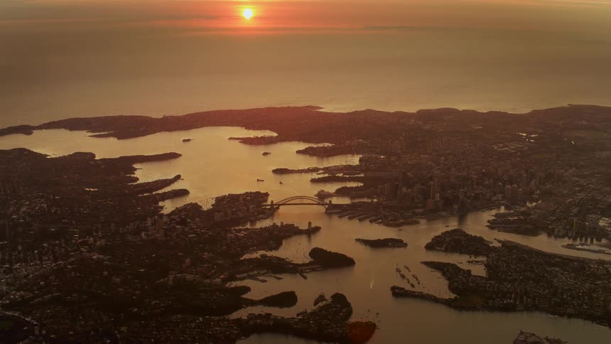 A portion of a body of water surrounded by a huge amount of rocks is filmed by a drone