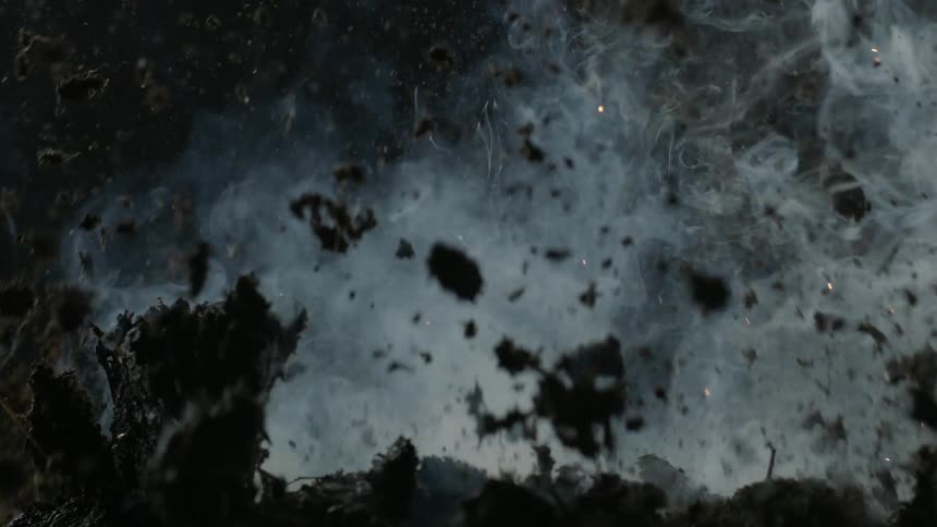 Smoke rises from the soil before it explodes