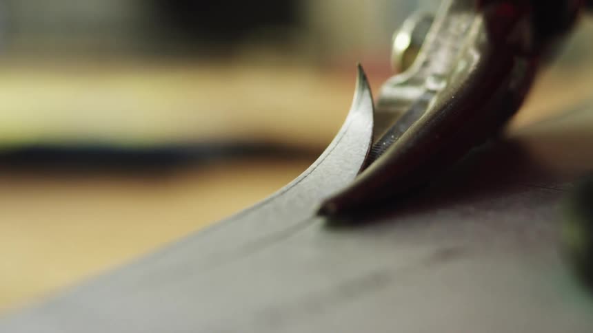 A piece of plastic is being trimmed
