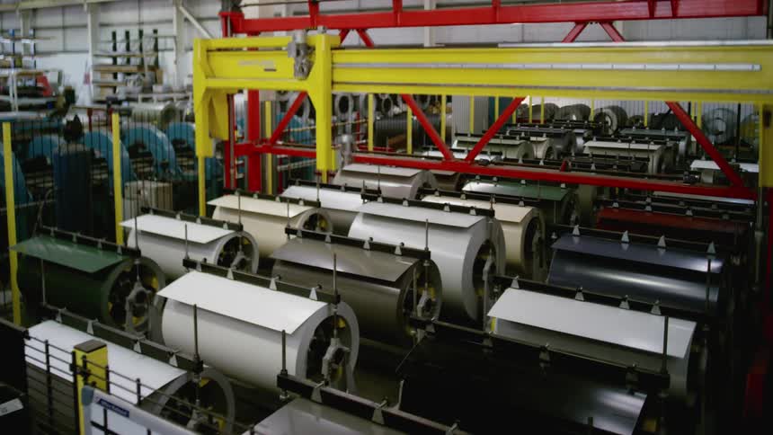The machine is moving things in the warehouse