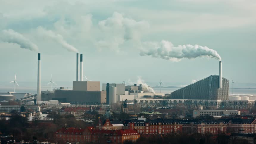 Smoke from smoke stacks of factory building