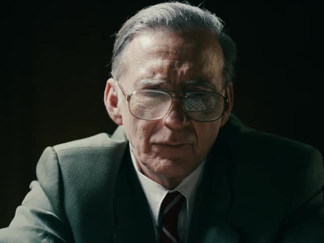 An old man with his glasses playing chess game that represents intellectual stimulation strategy and concentration