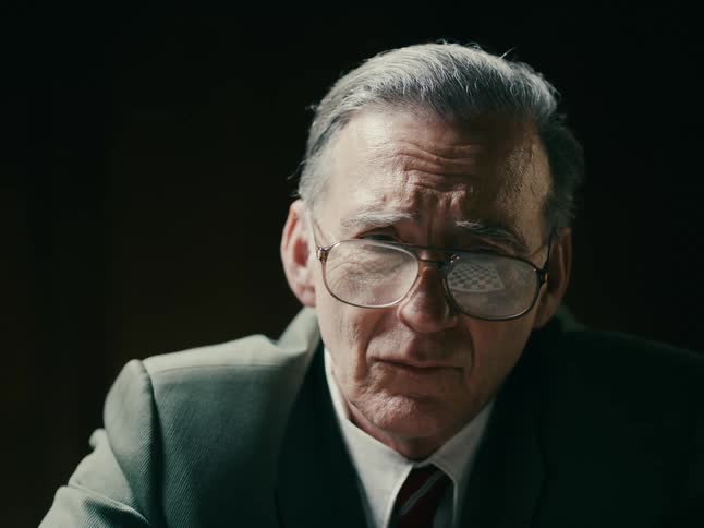 An elderly man who looks sad and confused the man appears to be in a quiet and isolated place with his head bowed down and his facial expression conveying a sense of hopelessness