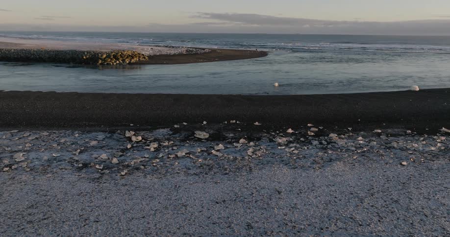 Ice forms on the surface of the ocean along the coast
