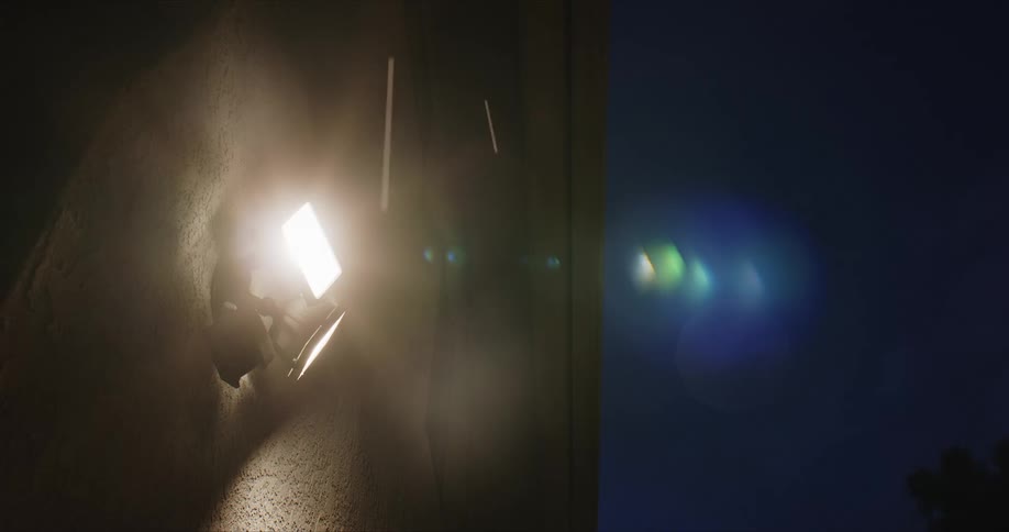 Outdoors lights fixed to a wall under the rain turns off at night