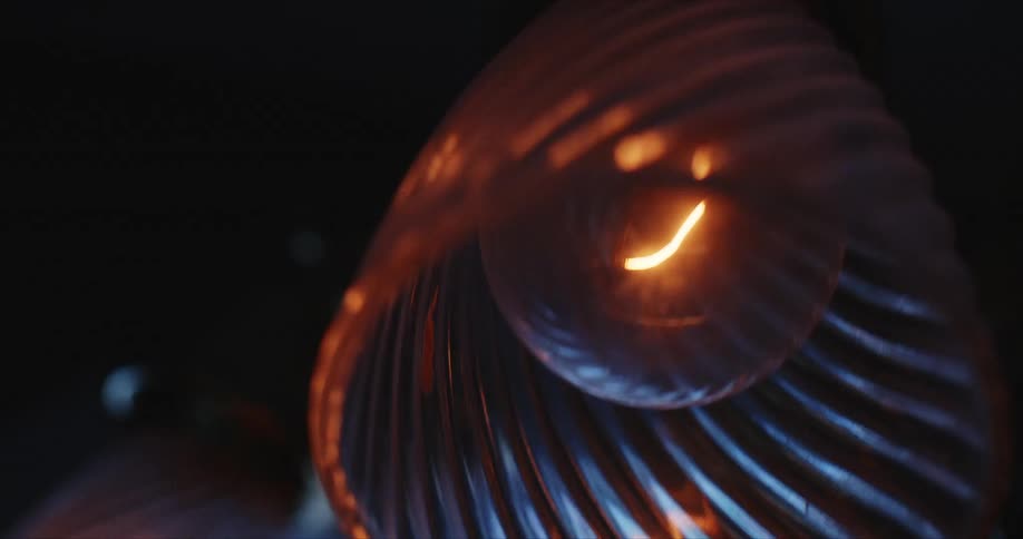 A pendant light swings from the ceiling