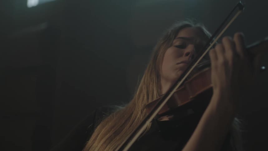 A woman is playing violin