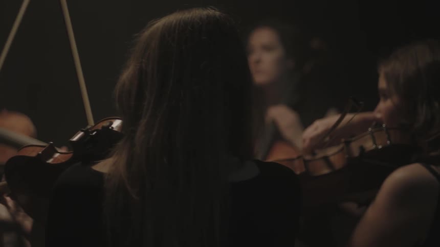 People are playing musical instruments in a circle