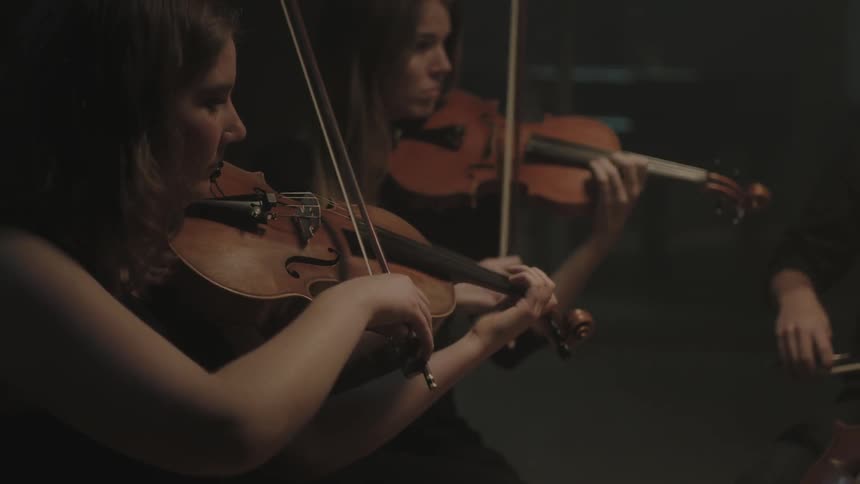 A woman is playing a musical instrument