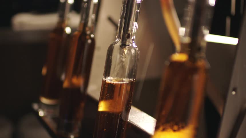 The machine is filling the bottles