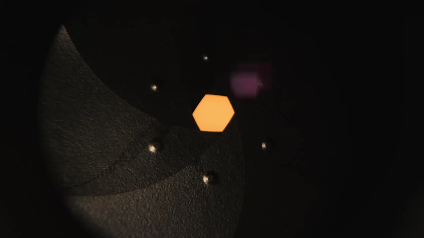 A close up of a camera lens aputure ring dialing in and out, open and close