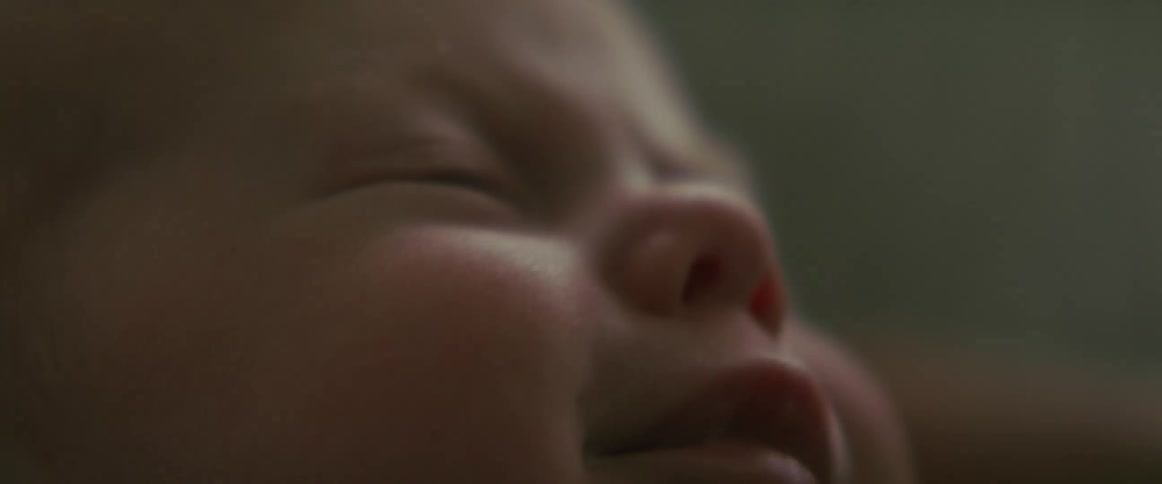 Close up of babys face crying