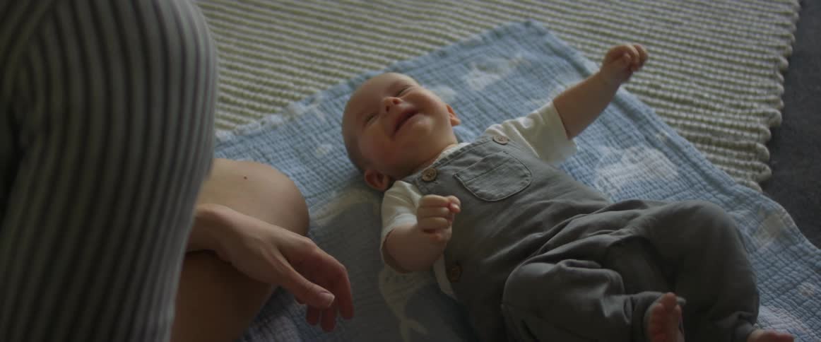The baby is moving around on the floor
