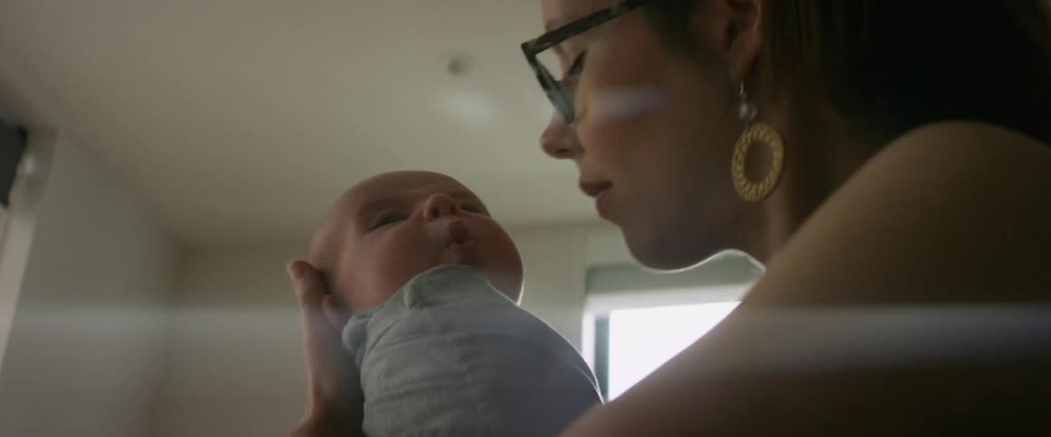 Baby being rocked by mother