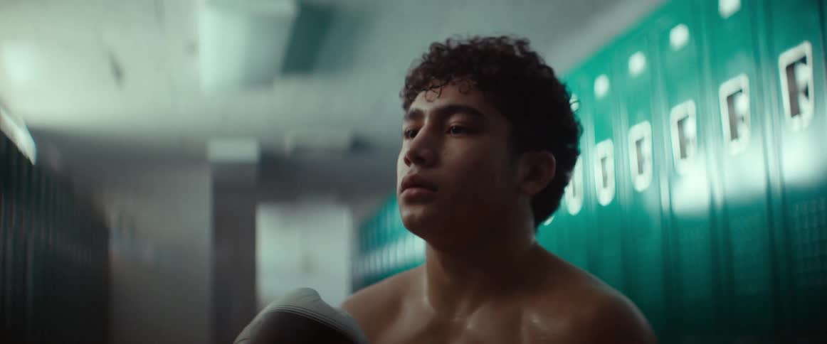 Young man getting ready for a boxing match in the locker room