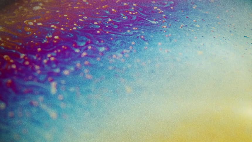 Drips flow between layers creating striations between colors in mixture