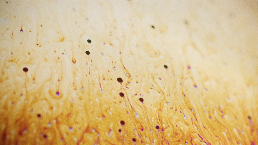 Spots flow through striated mixture of different colors