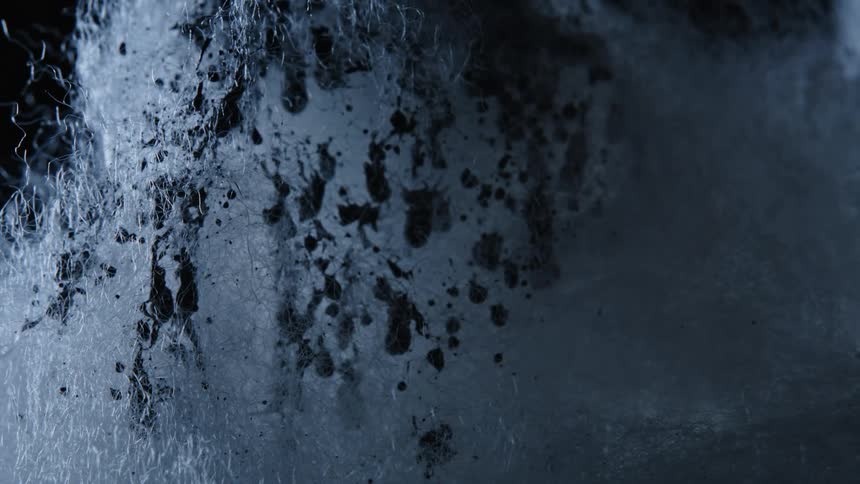 The object is covered in black