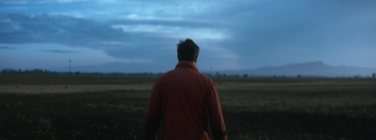 A man is walking on the field