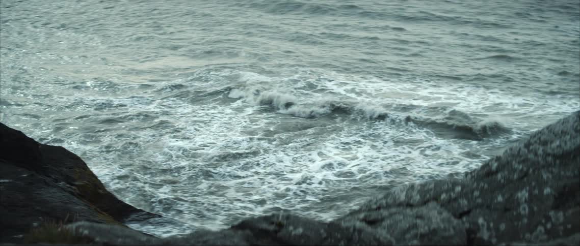 Waves crashing against rocks on a coastline