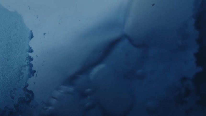 Water crashes against the glass