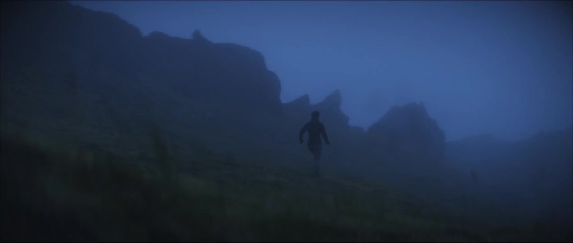 A woman runs in the dense fog