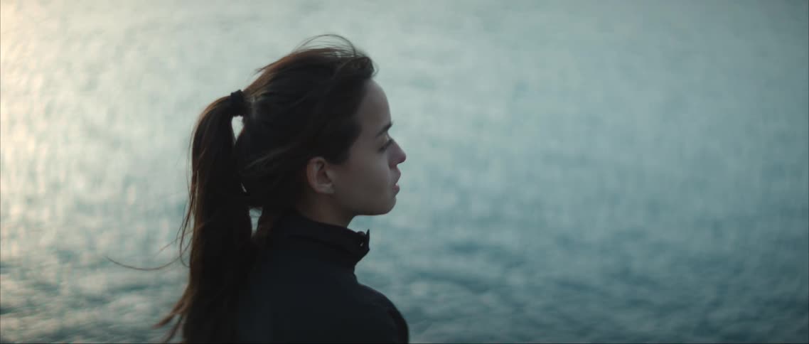 A woman is watching the water