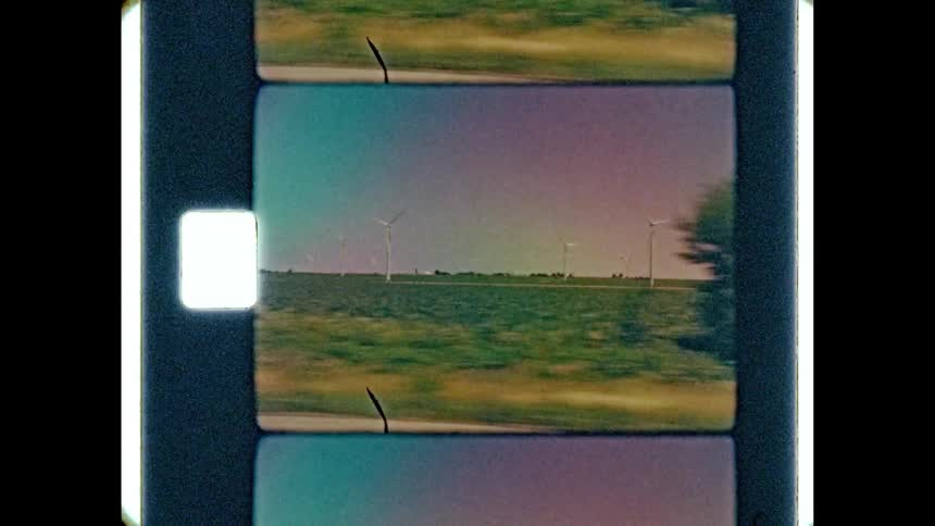 A highway runs along a rural field