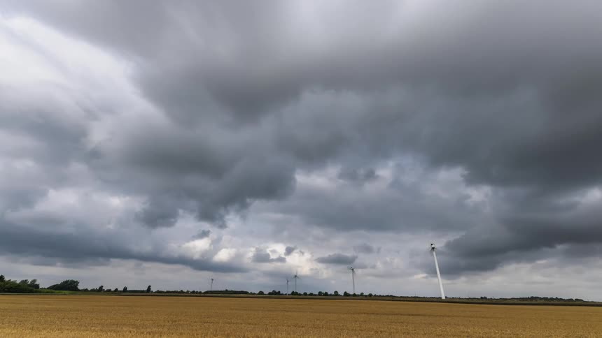 Wind turbines spin in a field